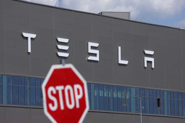Image for article titled Tesla earnings show plunging revenue as Elon Musk's EV maker warns of hits from Trump's tariffs