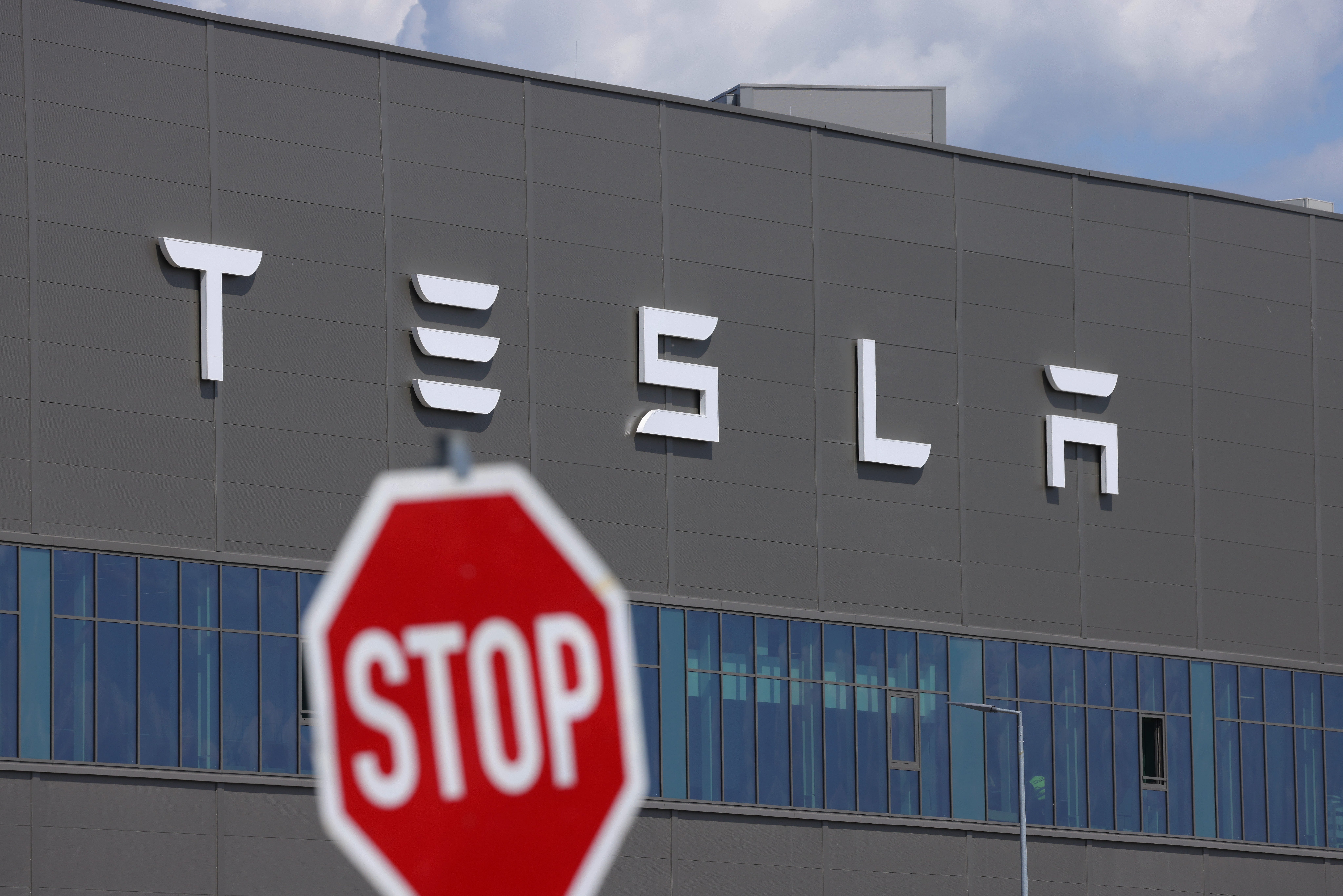 Image for Tesla earnings show plunging revenue as Elon Musk's EV maker warns of hits from Trump's tariffs