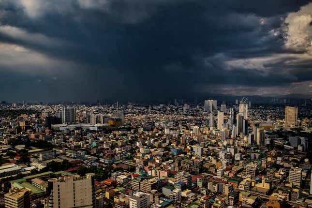 aerial view of storm clouds over buildings in Manila