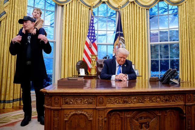 Tesla and SpaceX CEO Elon Musk, accompanied by U.S. President Donald Trump, and his son X Musk, speaks during an executive order signing in the Oval Office at the White House.